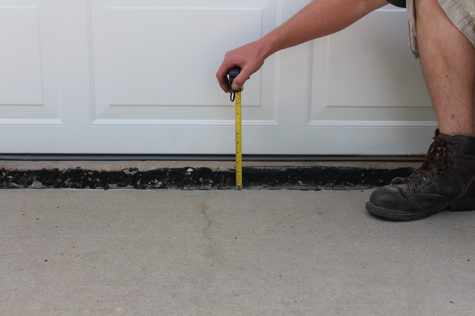 Uneven public walkway with sunken panel before concrete lifting